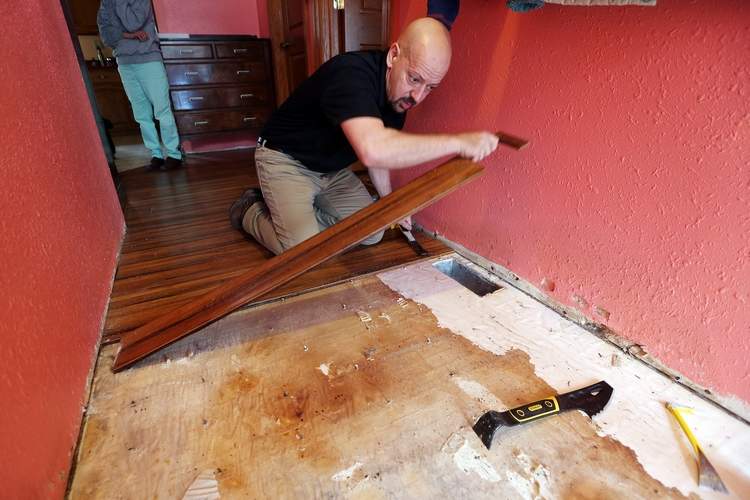 Restoration 1 man removing flooring